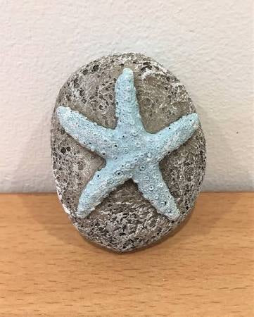 Carved resin starfish pebble