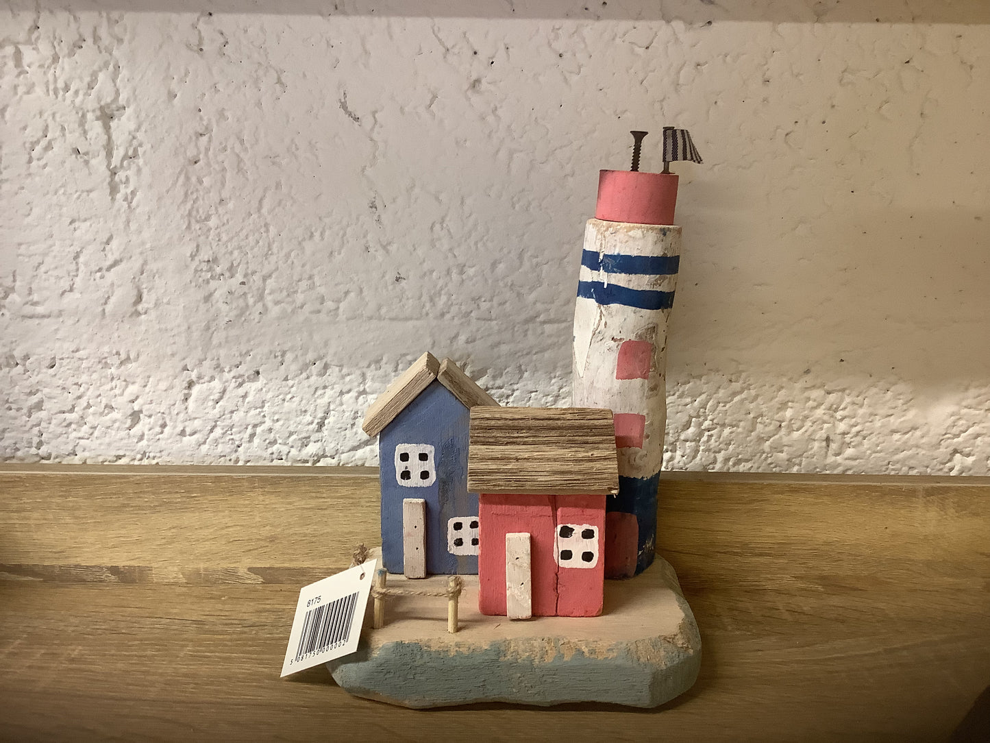 Wooden lighthouse with huts